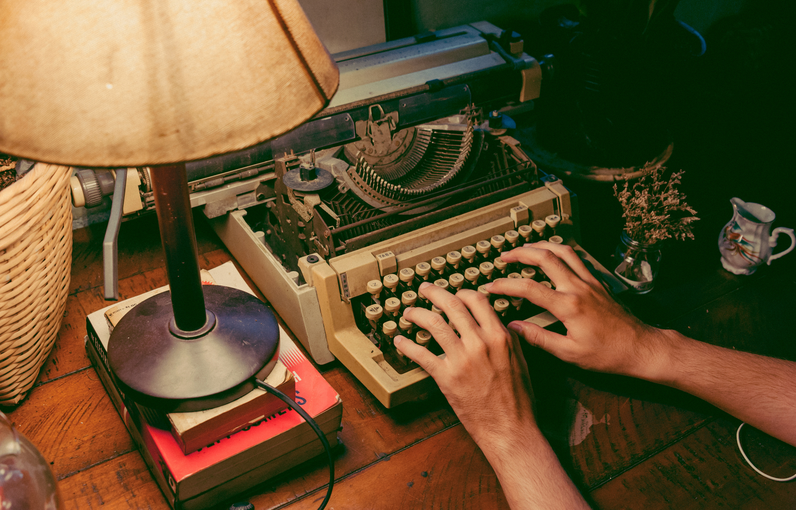 Person Typing On Typewriter